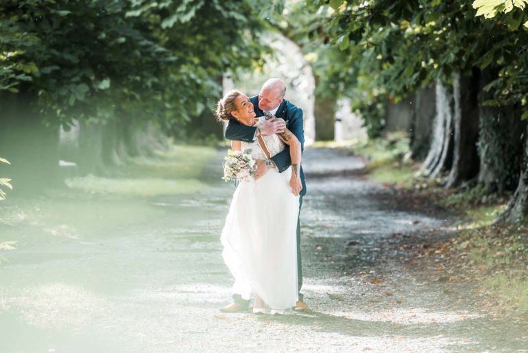 Romantic moment as the newlyweds share their first kiss as husband and wife.